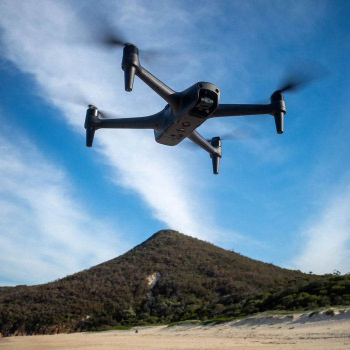 Aeroo Pro Drone flying in the sky with landscape in background