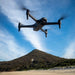 Aeroo Pro Drone flying in the sky with landscape in background