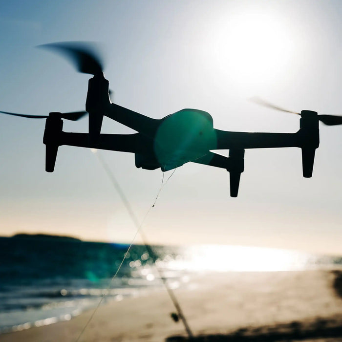 Aeroo Pro Drone flying over beach with fishing rod in background