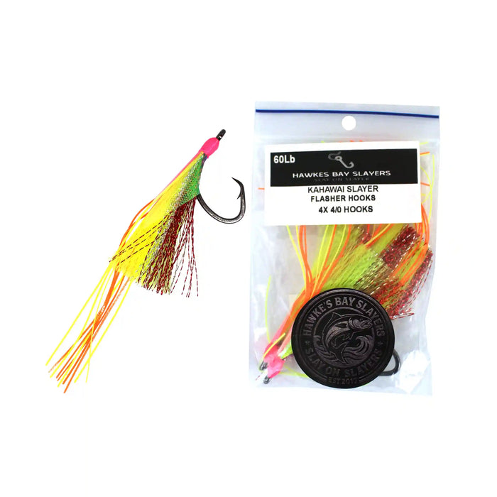 A package of Hawkes Bay Slayers flasher hooks shown next to one individual hook. The hooks feature a bright neon pink top, a green and yellow body, and orange and yellow skirt strands, with a black treble hook.