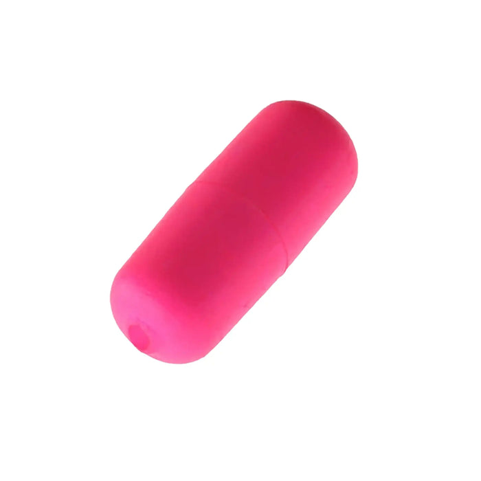 Pink cylindrical bait float on a white background